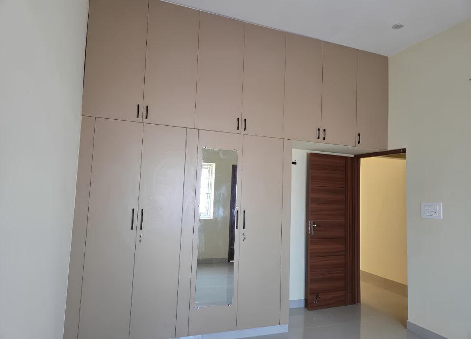 Wardrobe with loft designed by House Decors in Chennai