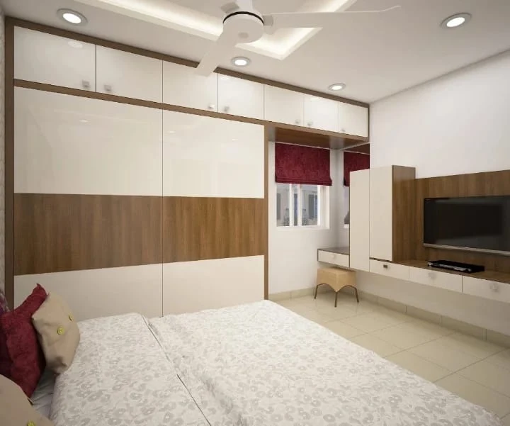 Bedroom with built-in wardrobe, dressing unit and TV unit by House Decors, Chennai