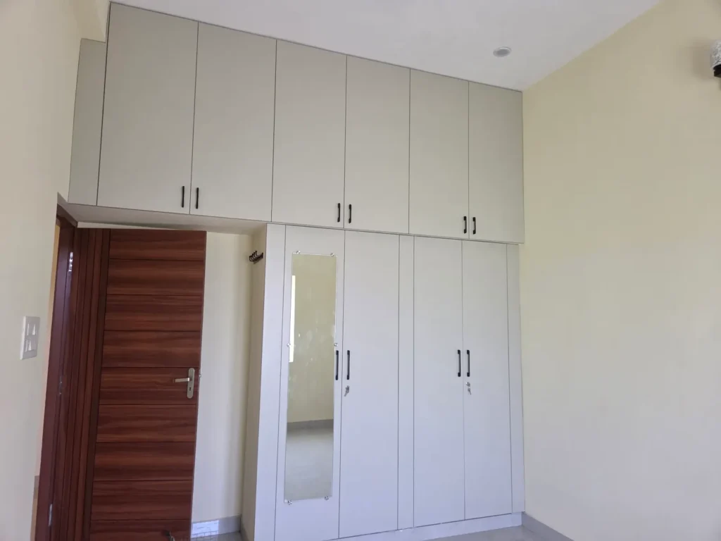 Wardrobe with mirror shutter and loft over the door, rental flat in Kodambakkam