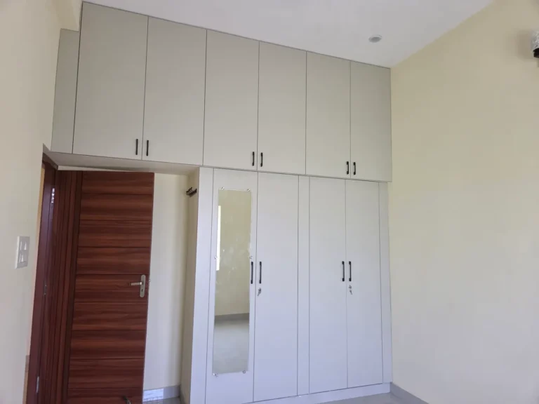 Wardrobe with mirror shutter and loft over the door, rental flat in Kodambakkam