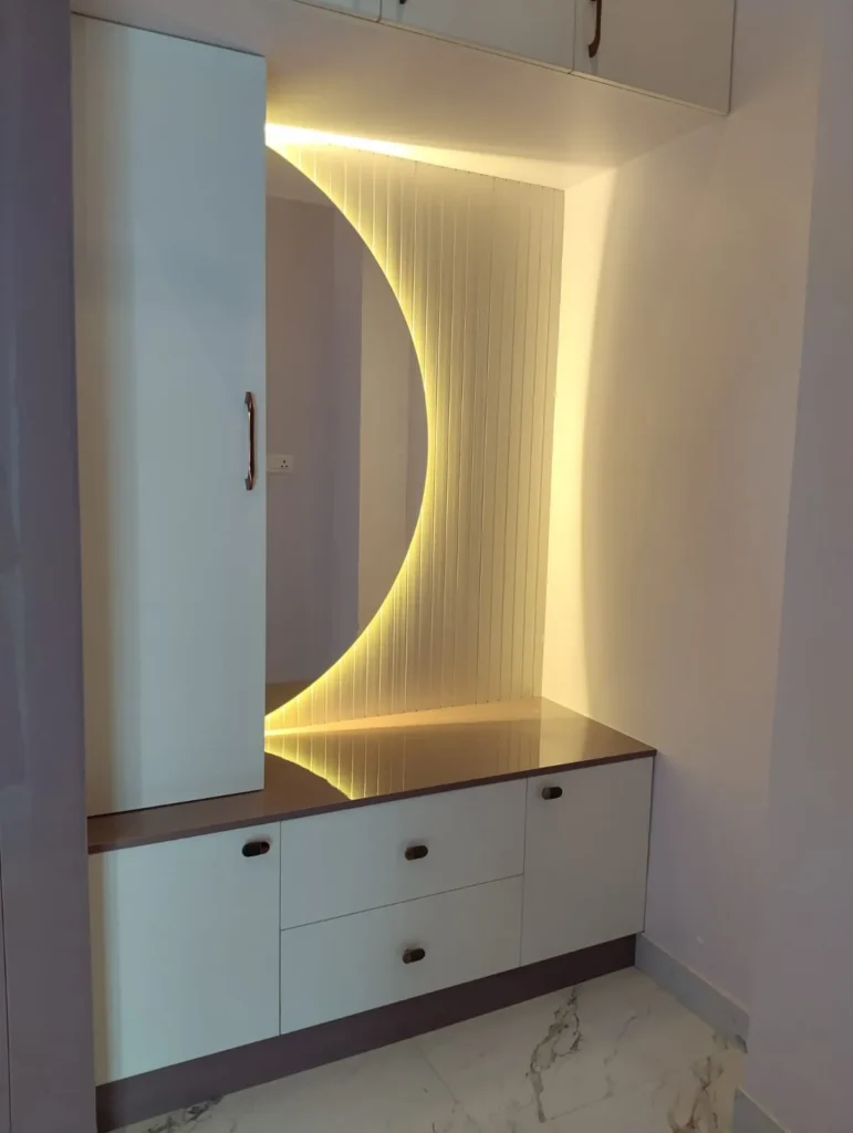 Dresser with a half-moon mirror, LED-lit fluted panel, drawers and cabinets, House Decors, Chennai